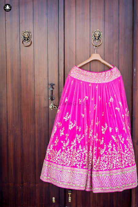 Photo of Fuchsia Pink Lehenga with Petals Embroidery on a Hanger