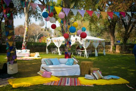 Day Mehendi Decor with Colorful Flags and Hanging Balls