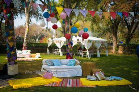 Photo of Day Mehendi Decor with Colorful Flags and Hanging Balls