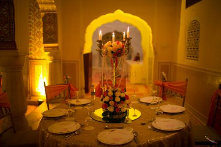 Photo of Gold and Orange Table Decor with Candelabras
