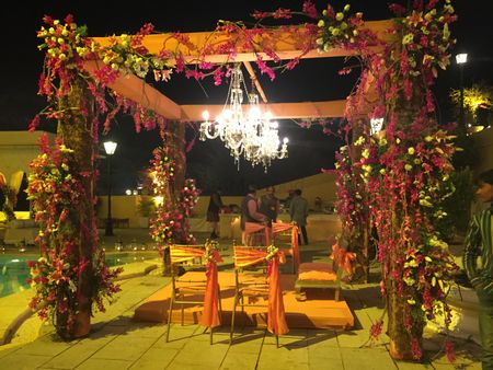 Photo of Outdoor Night Floral Tent with Chandeliers