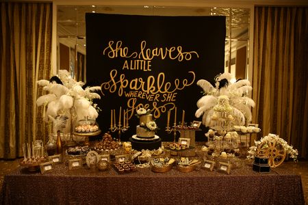 Photo of Gold Themed Table Decor with Blackboard Decor