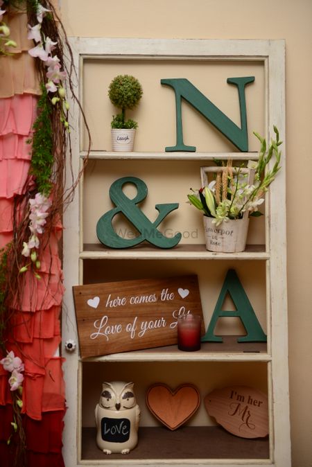 White Shelf board with Couple Initials and Floral Decor