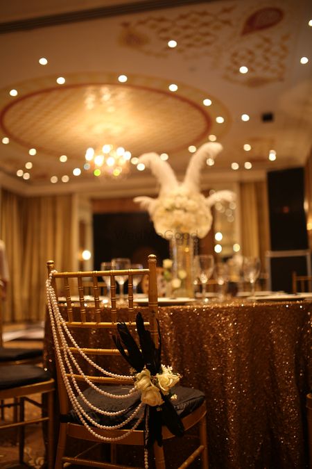 Gold Table and Seating Decor with Pearl Strings