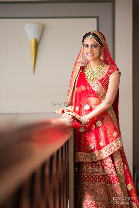 Photo of Red Bridal Lehenga with Gold Motifs