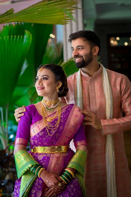 A Marathi color-coordinated couple on their wedding day 