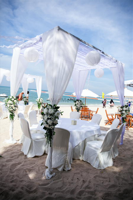 Photo of White beach wedding setting