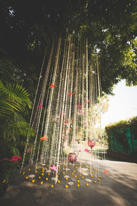 Photo of tree decor idea with hanging floral strings