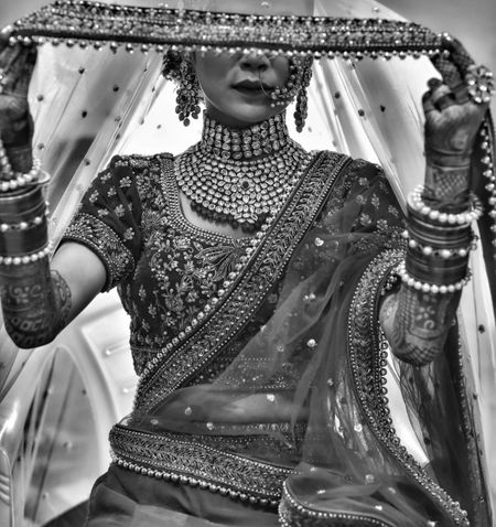 A bridal shot with jewellery's unique detailing. 