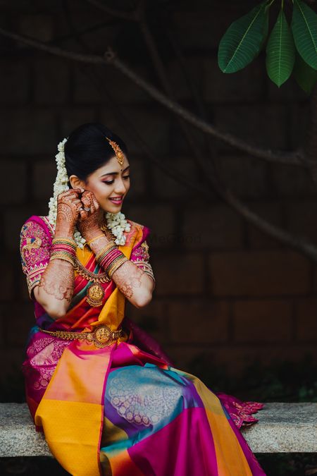south indian bridal look wearing her jewellery