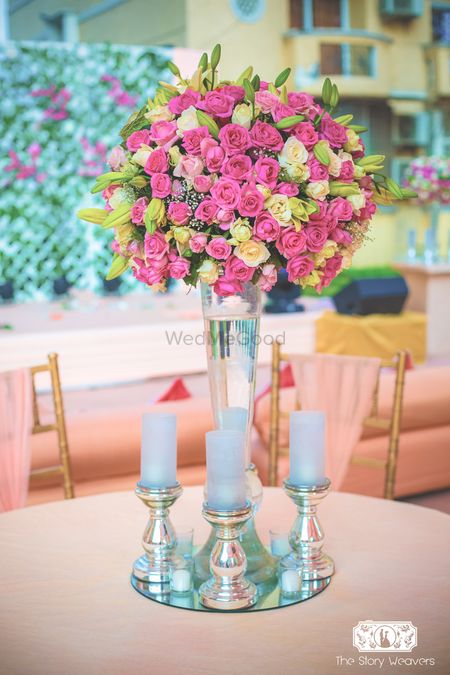 Photo of Pink and Yellow Floral with Candles Table Decor