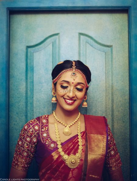 south indian bridal look with jewellery and red saree