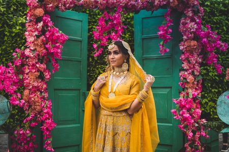 bride in marigold yellow lehenga with a modern look