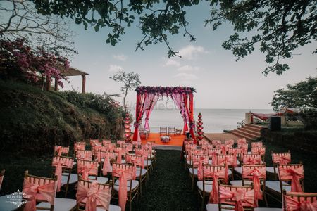 A beachside mandap in shades of pink and peach 