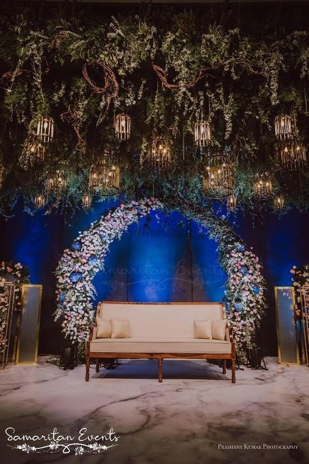 Photo of Stunning wedding decor idea with flowers and lights.