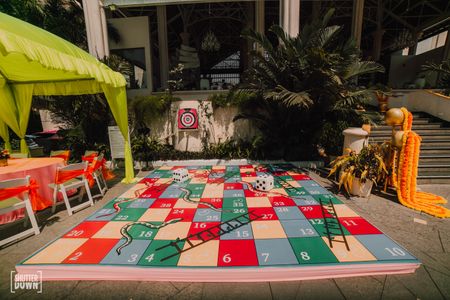 Photo of mehendi game idea with a giant snakes and ladders
