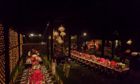 Photo of Night time wedding dinner setup