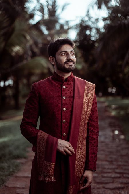 Photo of maroon sherwani and stole for the groom