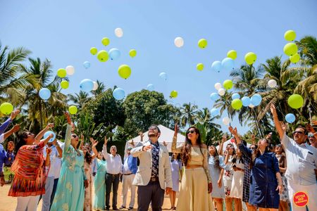 Photo of destination wedding couple exit idea with balloons