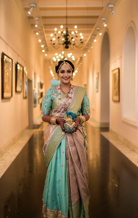 Photo of A south Indian bride in a unique hued kanjeevaram for her wedding