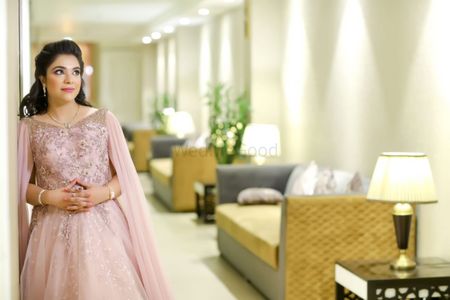 cocktail gown in light pink with cape sleeves