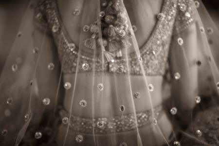 bridal close up shot with lehenga latkans in black and white 
