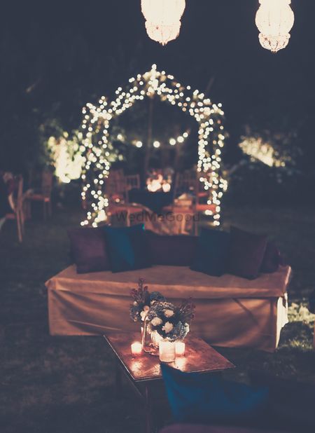 Photo of Fairy Lights Decor with Floral Centerpieces and Candles