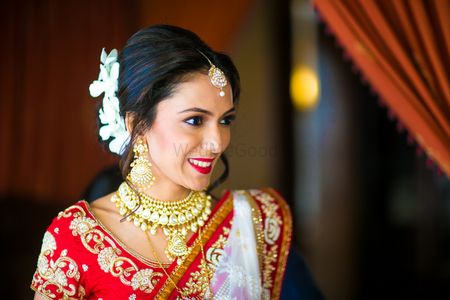 Bride in Red and White Lehenga and Floral Hair