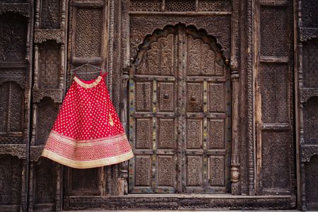 Red Bridal Lehenga with Border on a Hanger