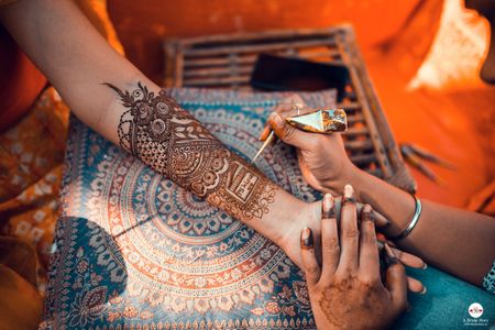 A mehndi design with a personalized text. 
