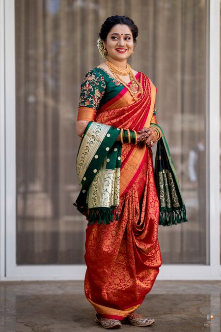 A happy Marathi bride in silk nauvari saree. 