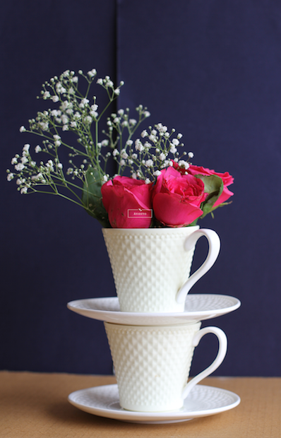 Double Tea Cups with Flowers Centerpiece