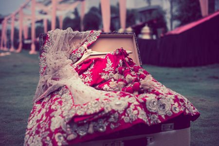 Red bridal lehenga inside trunk