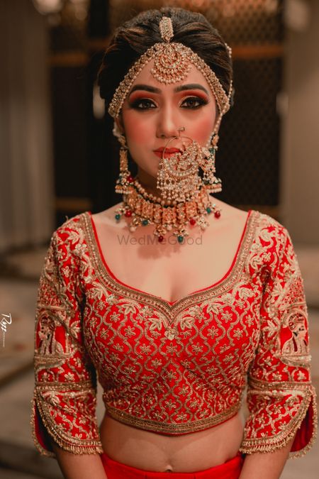 Photo of A bride wearing gorgeous jewellery on her wedding day.
