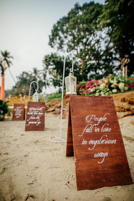 Photo of  Boards with love quotes on the beach