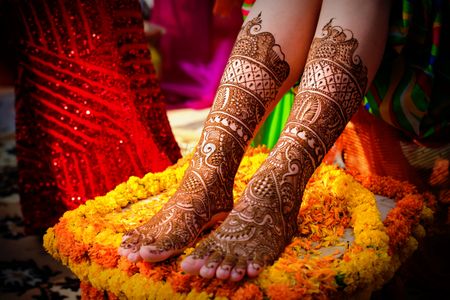 A beautiful bridal feet mehndi design.
