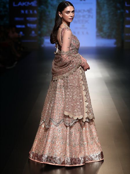 Photo of rose gold modern lehenga with a scalloped border