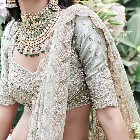 Photo of sage blouse with heavy green bridal set