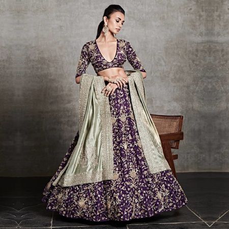 embroidered purple lehenga for reception with heavy work