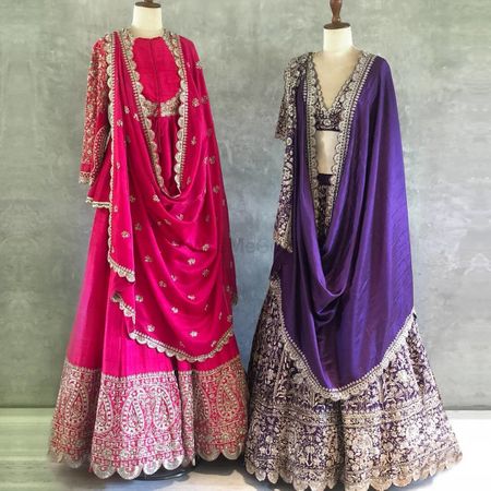 Photo of Vibrant pink anarkali with detailing and purple lehenga with silver work.