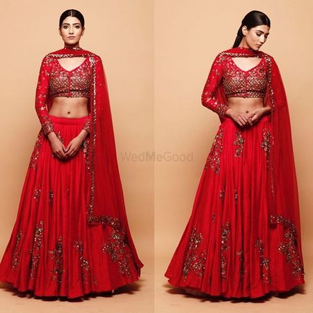 Photo of Vibrant red & gold lehenga for friends of the bride or groom.Perfect for a fun filled cocktail night.