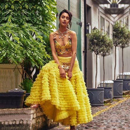 Mehreen pirzadaa in a yellow lehenga by Seema gujral for post engagement  photoshoot 2018 – South India Fashion