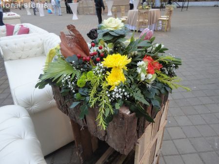floral arrangement in wheelbarrow