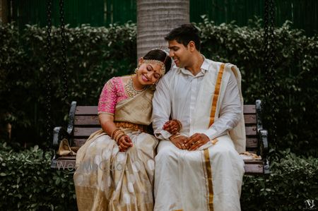 A happy couple enjoying a moment post their wedding ceremony.