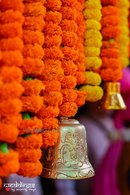 Orange Genda Phool Decor with Gold Bells