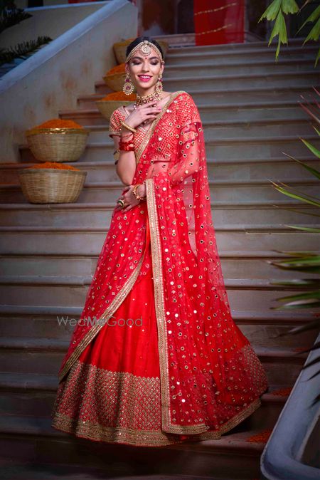 Photo of A beautiful bridal lehenga portrait.