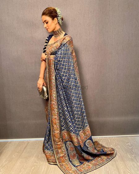 Heavy banarasi blue and gold saree great for a Reception.