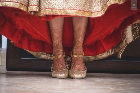 Bride Wearing Gold Shoes and Anklets