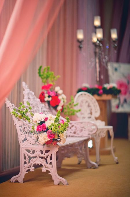 Photo of victorian white vintage chairs with flowers