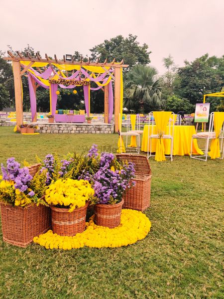 unique mehendi or haldi decor theme in lavender and yellow